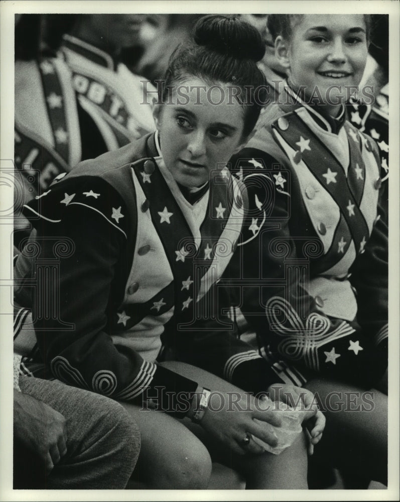 Robert E. Lee High band member ices knee injured during Oilers game. - Historic Images