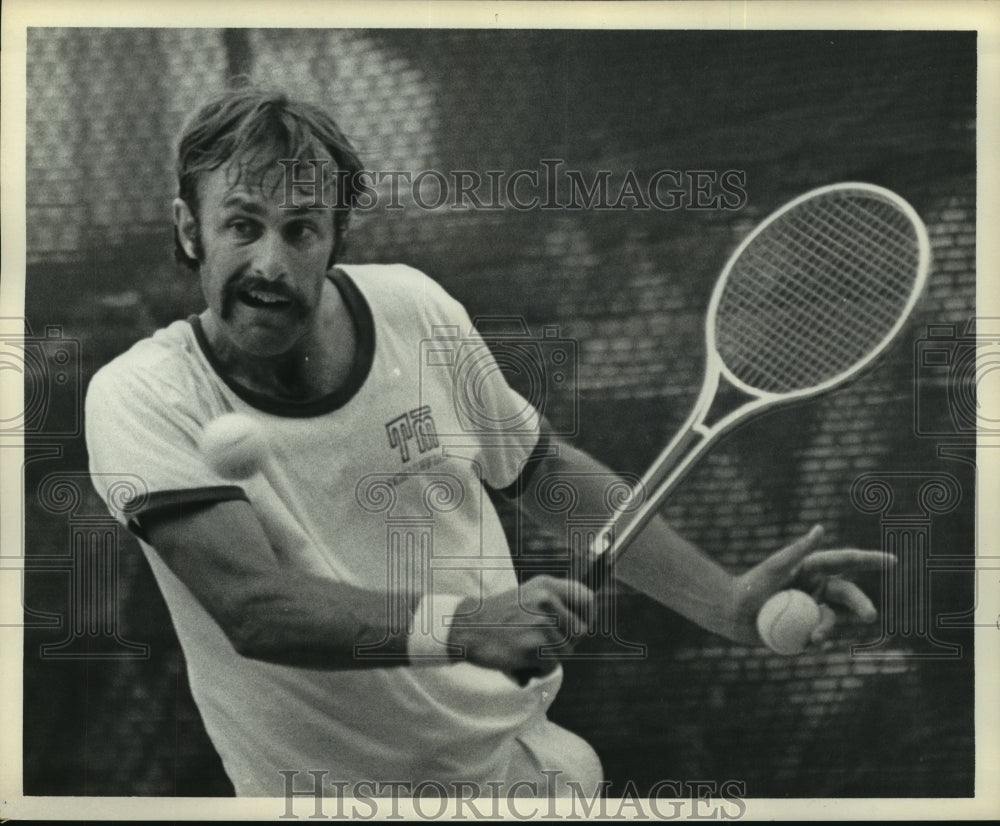 1972 Professional tennis player John Newcombe practices for match. - Historic Images