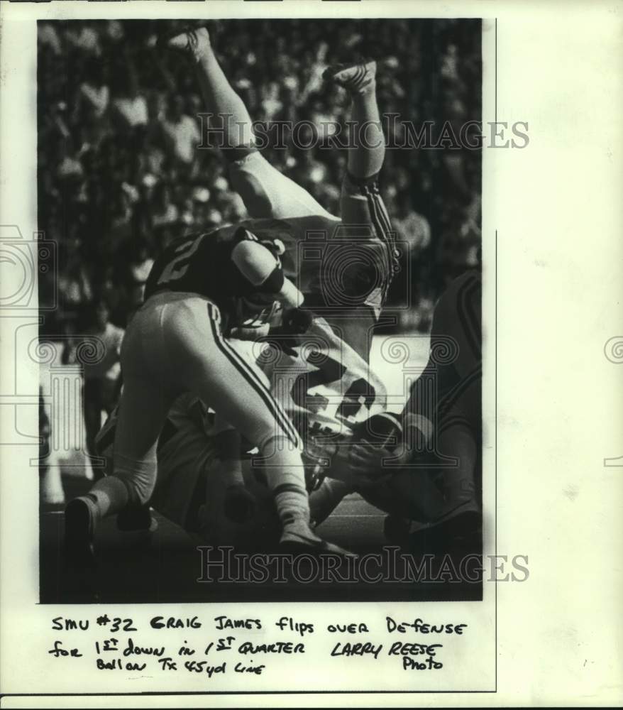 1982 Press Photo SMU back Craig James flips over Texas defense for 1st down - Historic Images