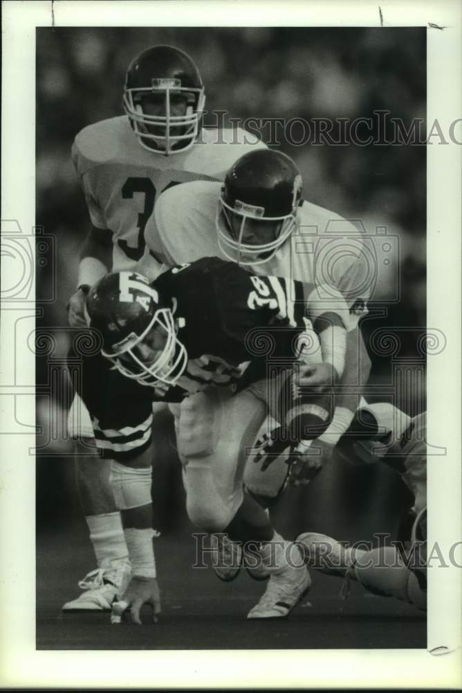 1987 Press Photo Texas A&amp;M&#39;s Matt Gurley fumbles after hit from Arkansas&#39;s Floor- Historic Images