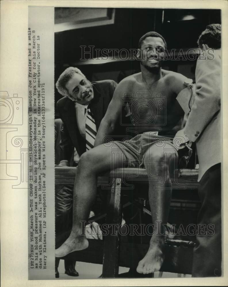 1971 Dr. Kleiman takes Joe Frazier's blood pressure for Ali fight. - Historic Images
