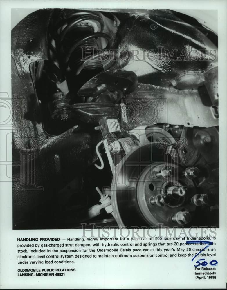 1985 Press Photo Suspension Oldsmobile Calais, the Indianapolis 500 pace car. - Historic Images