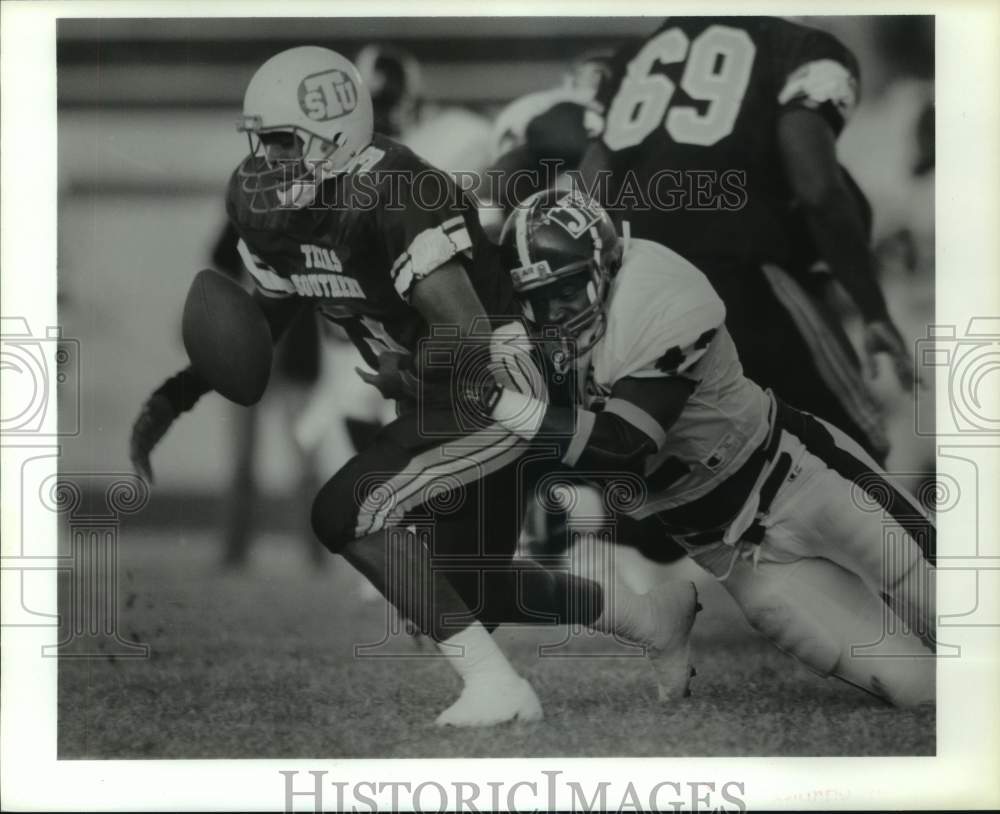 1991 TSU&#39;s Stacy Moore fumbles; Jackson States&#39; Carl Tart makes hit. - Historic Images