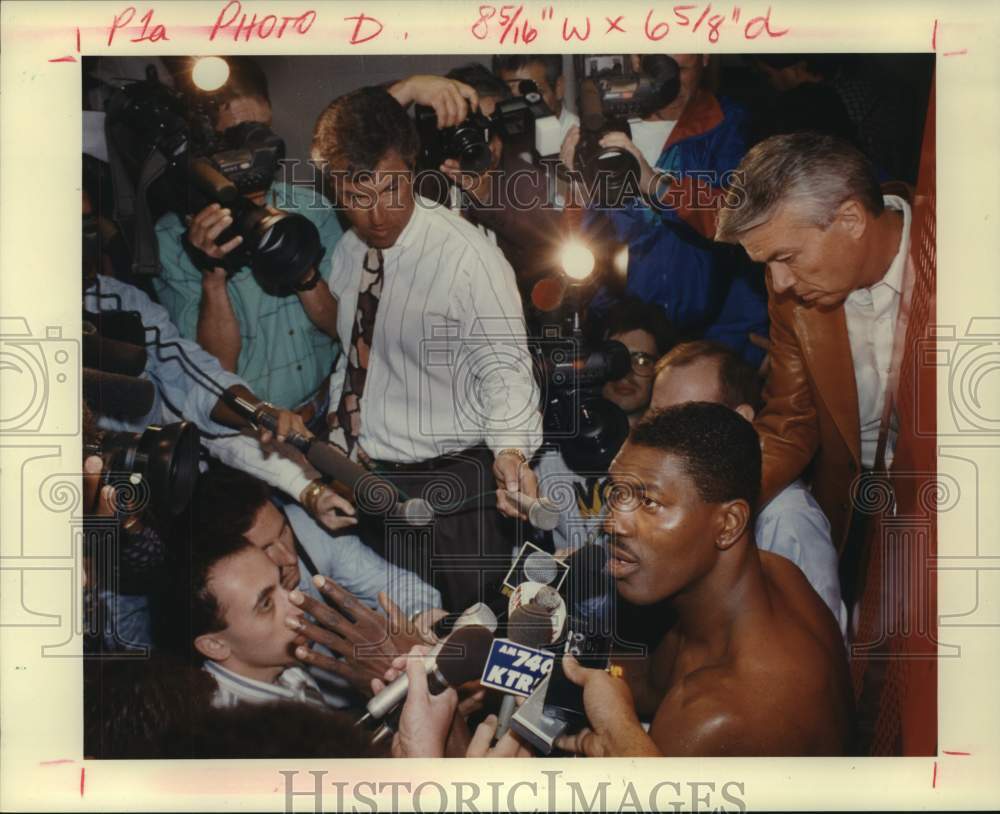 1992 Reporters crowd around Houston Rockets center Hakeem Olajuwon - Historic Images