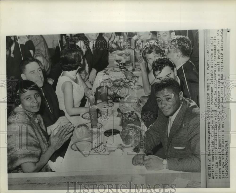 1961 Floyd Patterson and mom celebrate boxing championship in Miami - Historic Images