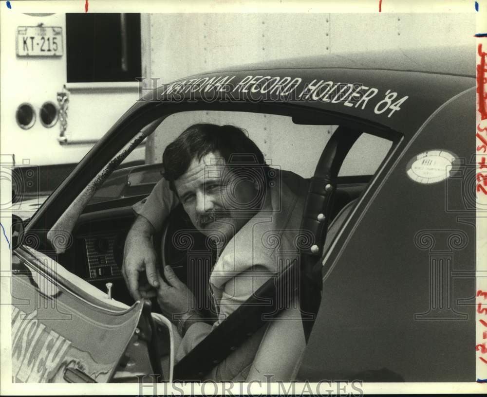 1984 Drag racing record holder Glen Tinsley sits behind wheel of car - Historic Images