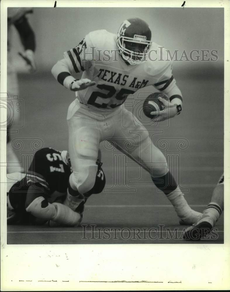 1989 Texas A&M Darren Lewis pulls along Rice defender OJ Brigance - Historic Images