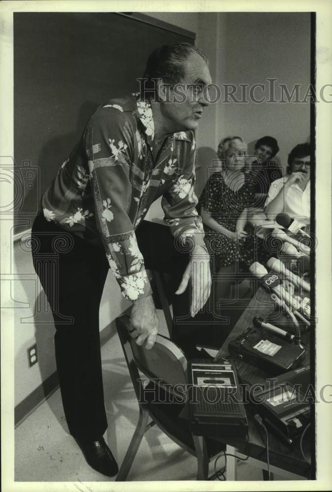 1983 University of Houston coach Guy Lewis talks during interview. - Historic Images