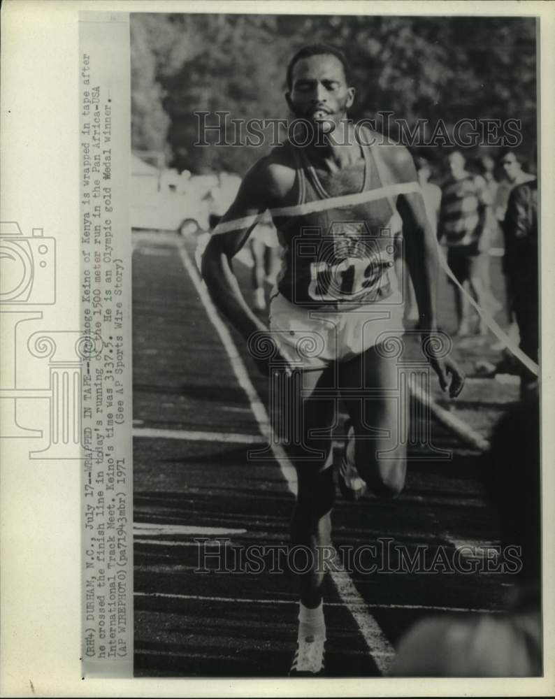 1971 Kipchoge Keino of Kenya wrapped in tape at Pan Africa-USA meet - Historic Images