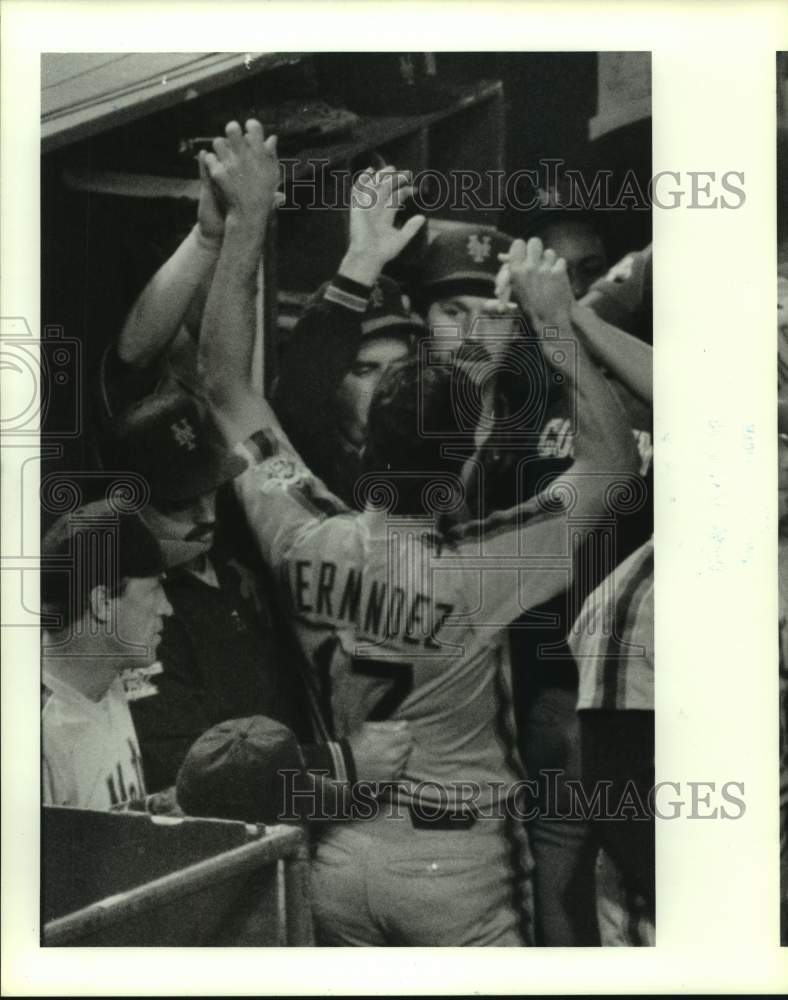 1986 Mets' Keith Hernandez is congratulated by team for scoring run. - Historic Images