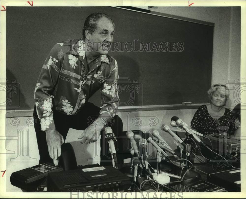 1983 University of Houston coach Guy Lewis at a news conference - Historic Images