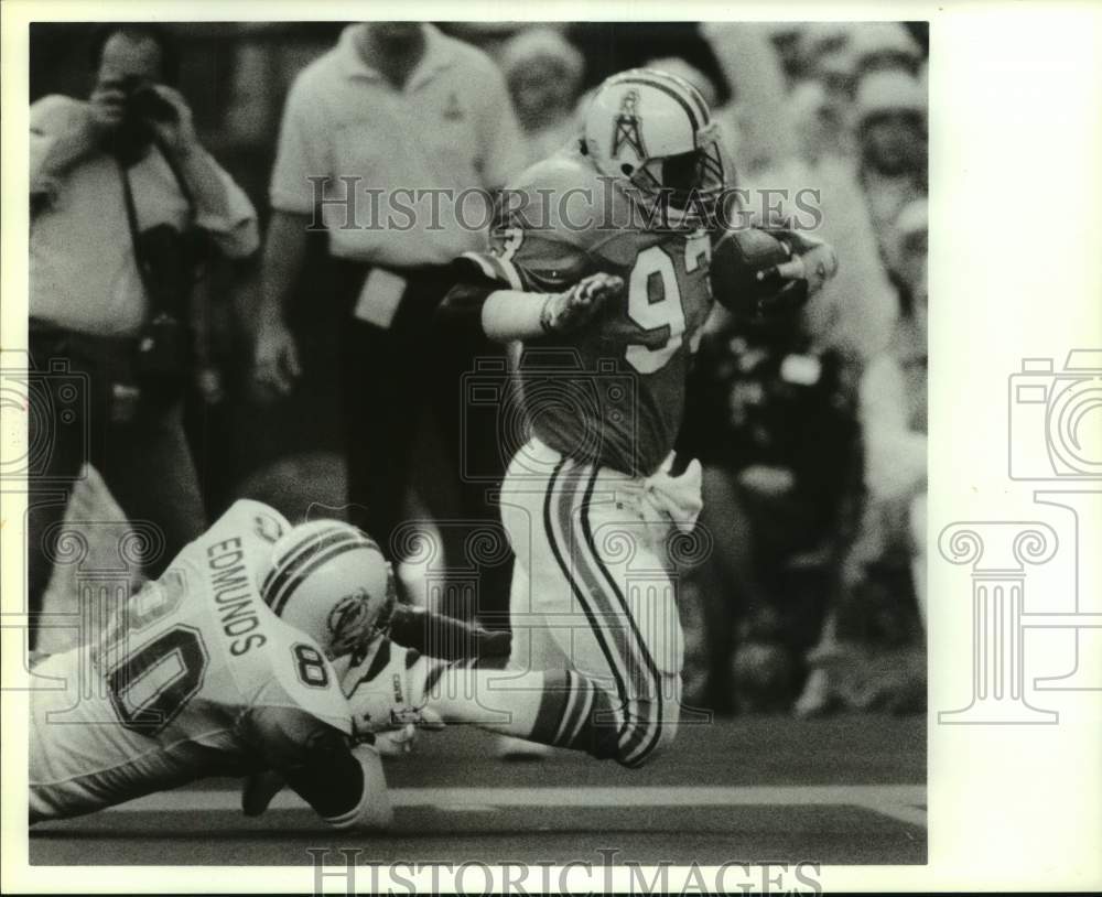 1989 Houston Oilers&#39; Robert Lyles brought down after interception - Historic Images