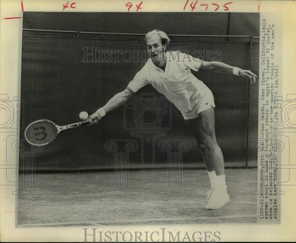 1974 Stan Smith leaps across court for forehand return at Wimbledon - Historic Images