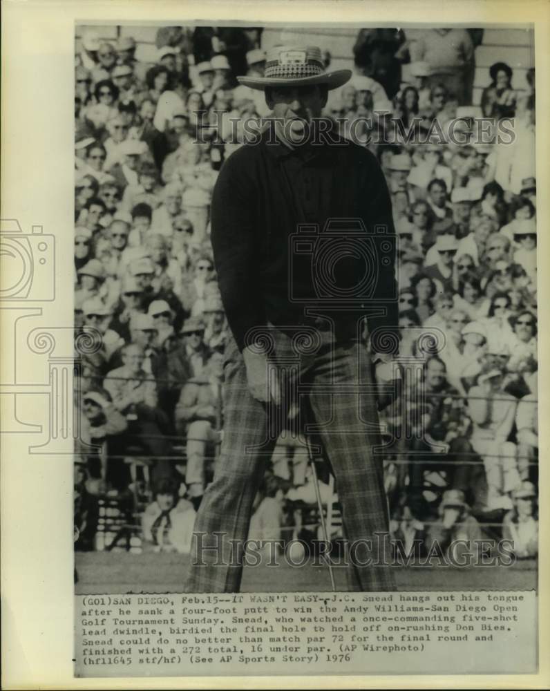 1976 J. C. Snead hangs out his tongue after he sank putt for a win - Historic Images