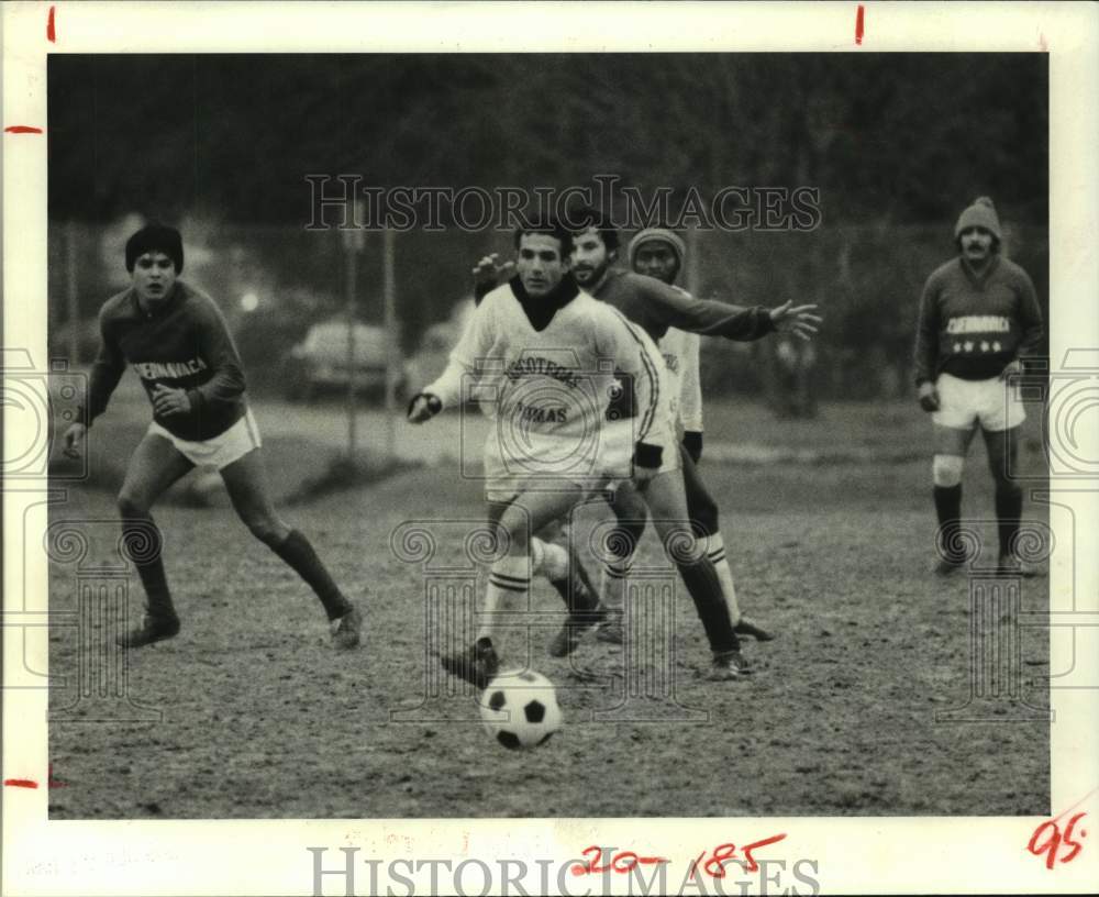 1981 Soccer players brave the elements at Memorial Park in Houston. - Historic Images