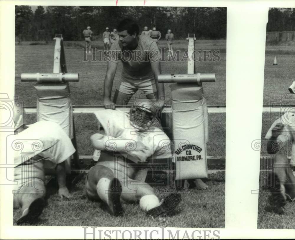1986 New Waverly football coach Larry Spacek watches practice - Historic Images