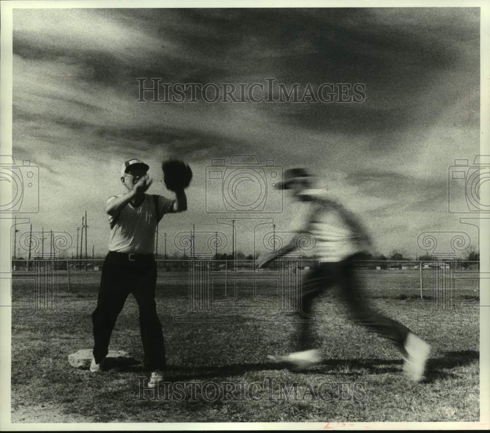 1982 Stan Ward beats throw to Jim Rush in Senior Softball League.-Historic Images