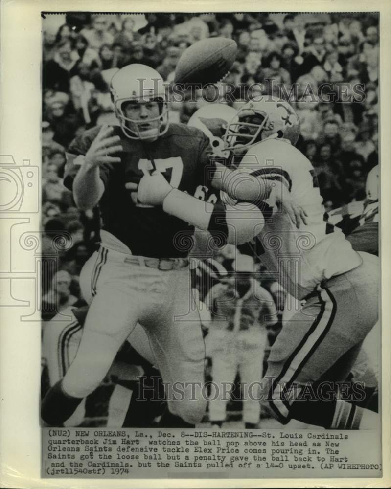 1974 Press Photo Saints&#39; Elex Prices knocks ball from Cardinals&#39; Jim Hart.- Historic Images