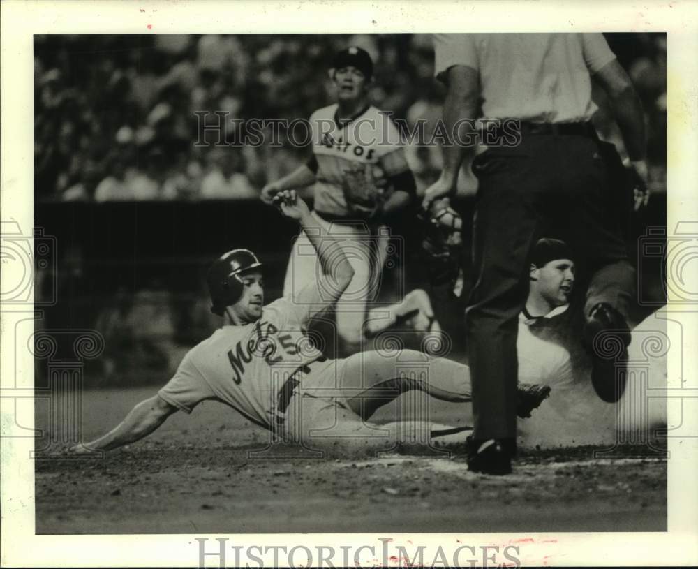 1985 Press Photo Mets player slides into home in game with Houston Astros - Historic Images