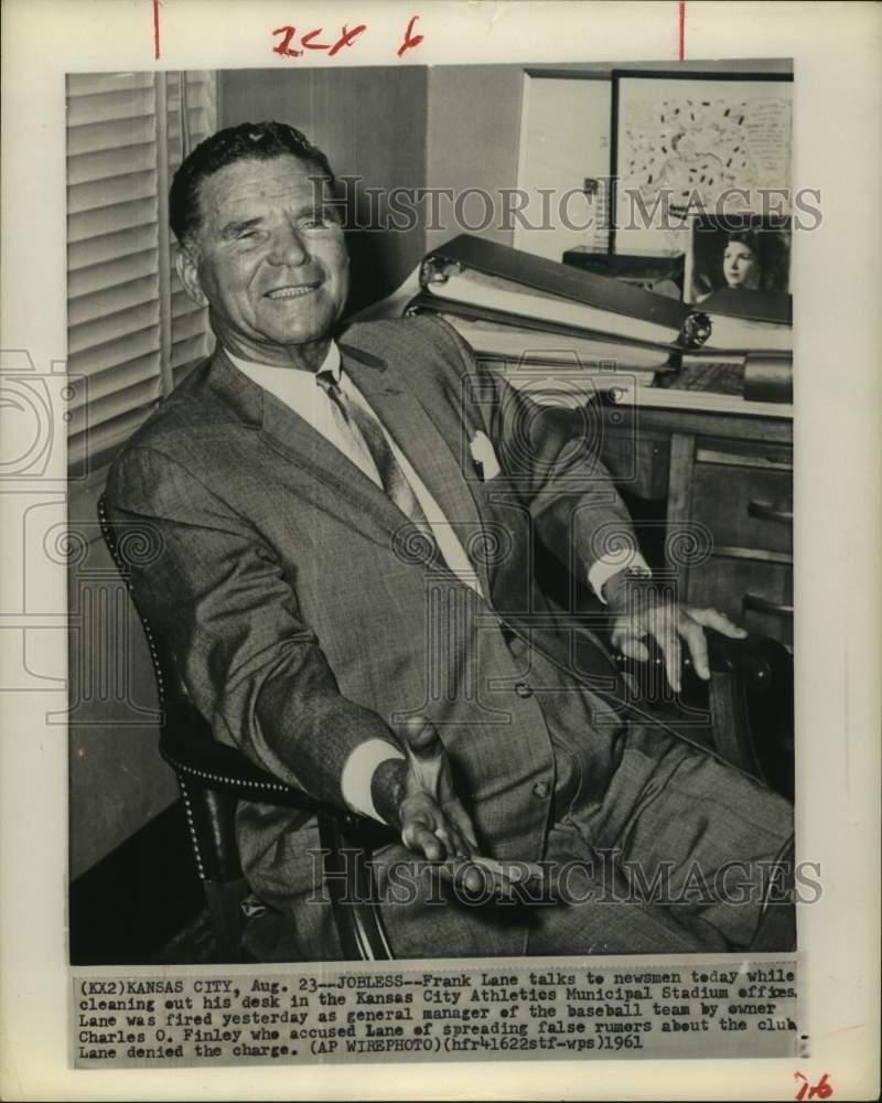 1961 Press Photo Kansas City baseball general manager Frank Lane sits at desk - Historic Images