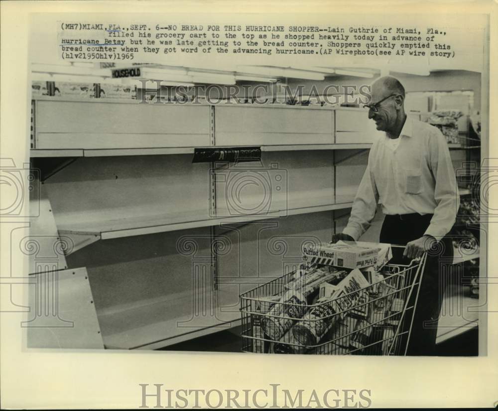 1965 Miami citizen Lain Guthrie shops to prepare for Hurricane Betsy-Historic Images