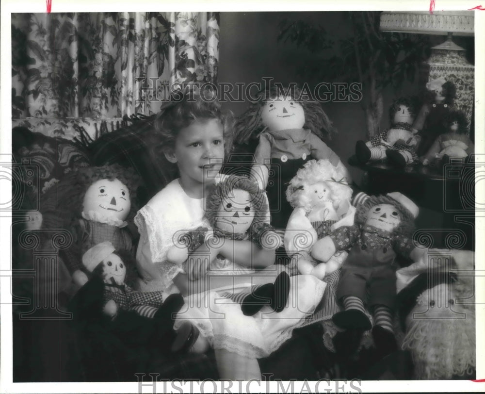 1968 Christmas theme, and girl with Raggedy Anns dolls - Historic Images