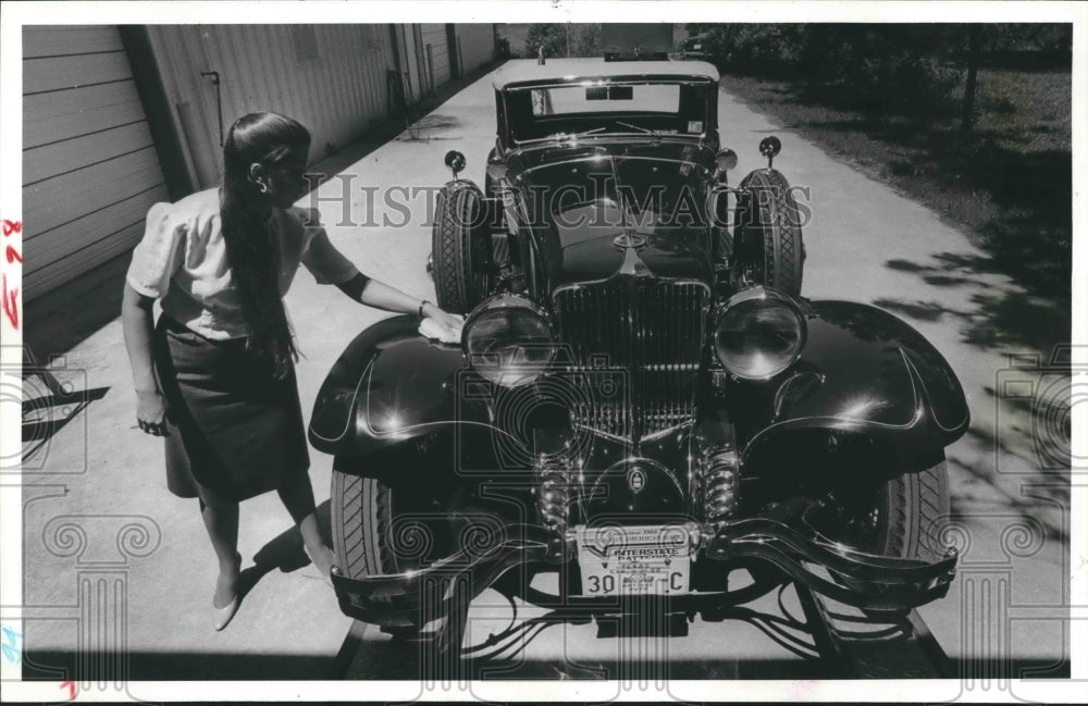 1984 Deena Williams brushes some dust off Antique 1930 Cord - Historic Images