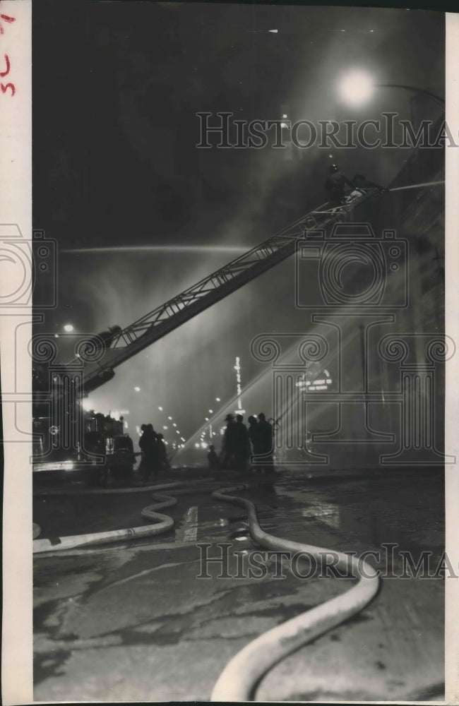 1954 Press Photo Firemen Spraying Water on Blaze at Uptown Garage, Houston.-Historic Images