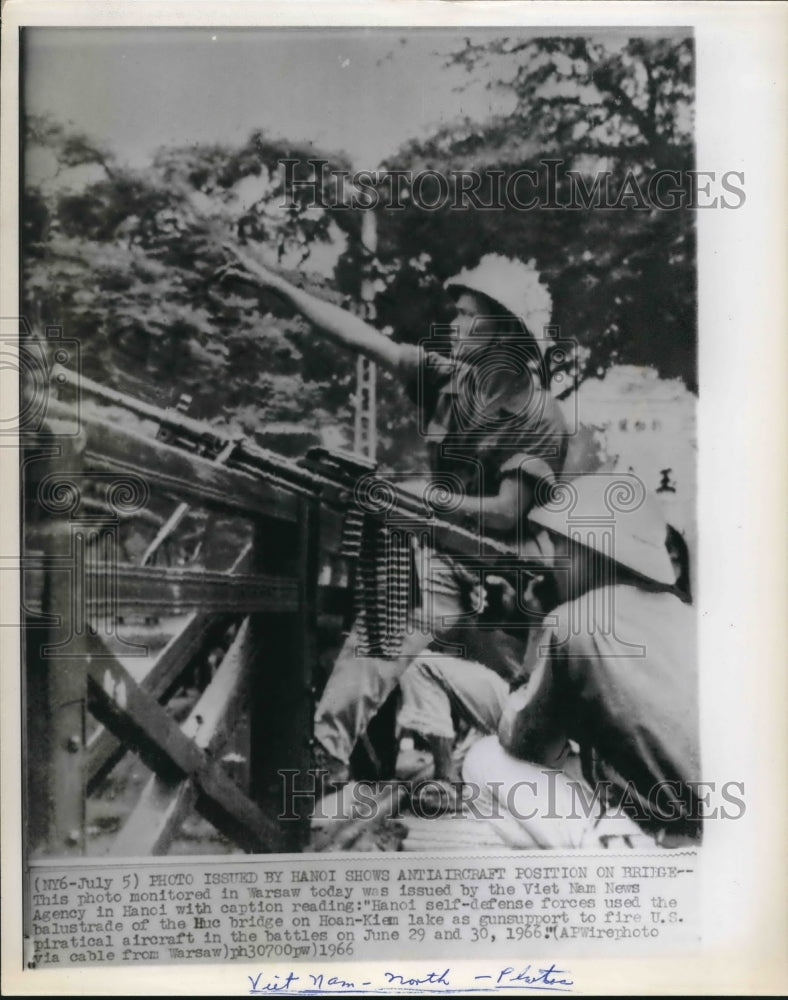 1966 Vietnam soldiers use bridge as support to fire at US Aircraft - Historic Images