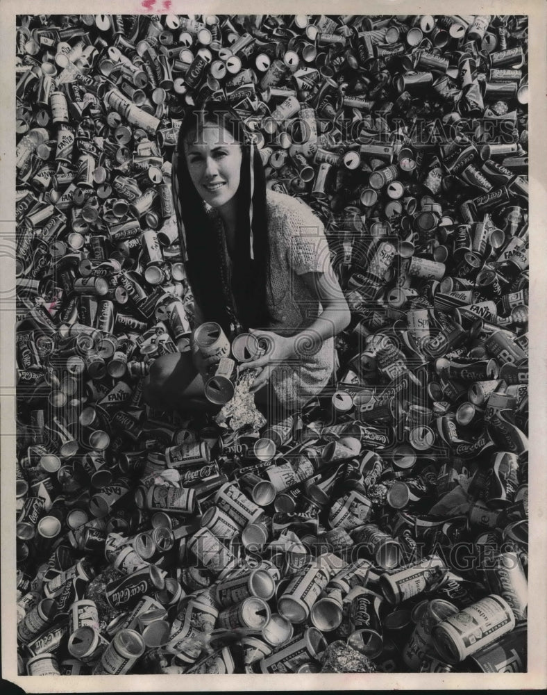 1971 Mrs. Diann Naden Sits Atop a Ton of Discarded Aluminum Cans. - Historic Images