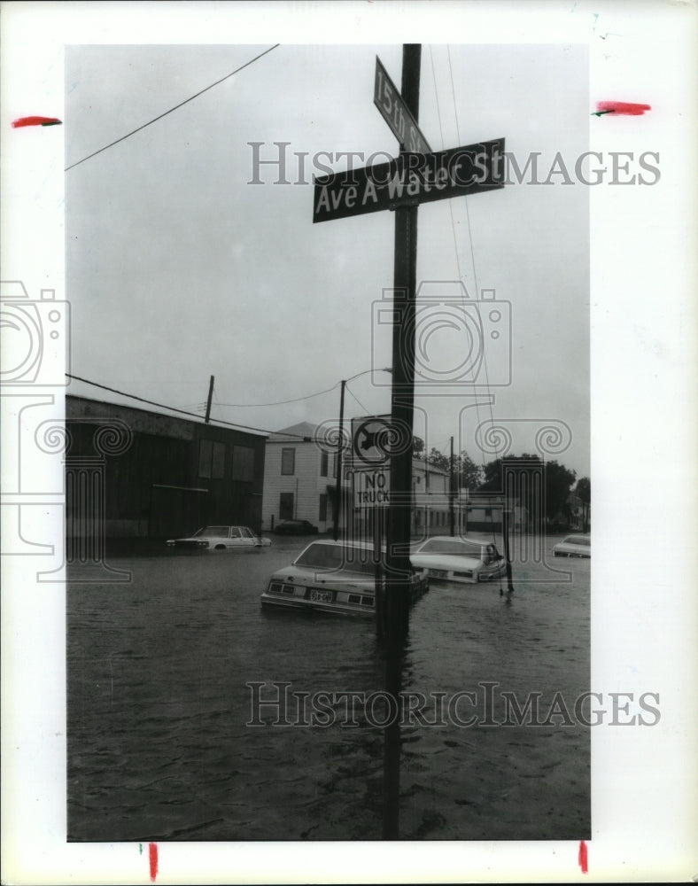 1989 Cars on Flooded Water Street After Hurricane Chantal, Galveston - Historic Images