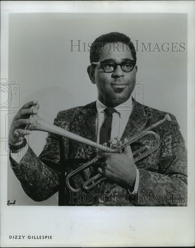 1975 Dizzy Gillespie holds his horn - Historic Images