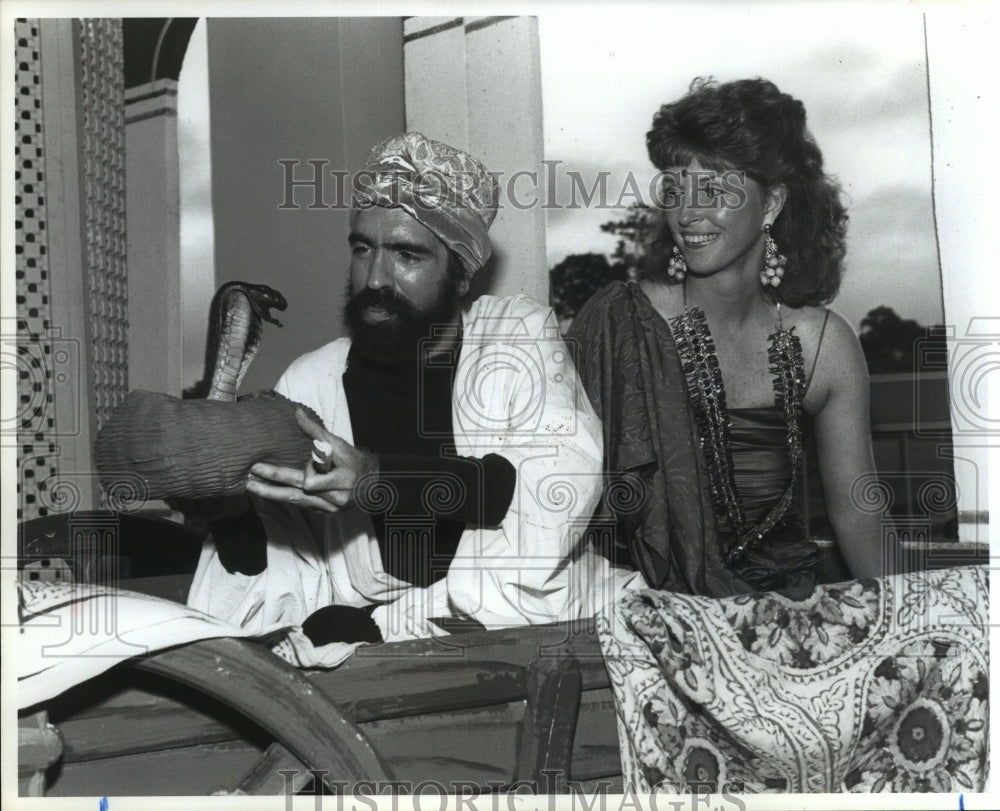 1990 Carol Holmsten with snake charmer E.J. Nolan at Houston Ball - Historic Images