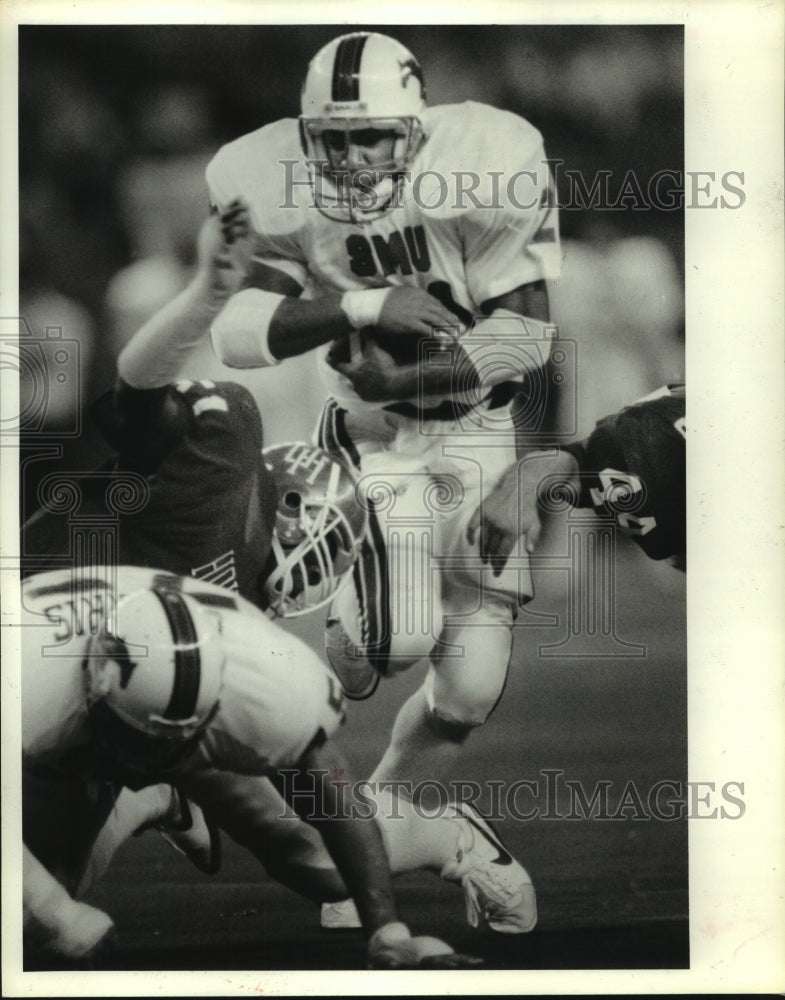 1985 SMU Mustangs Football Player Reggie Dupard Breaks for Yardage. - Historic Images