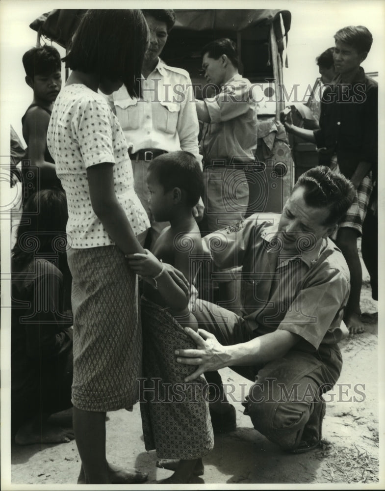 1962 Press Photo Dr. Ramond Miguel takes blood from leprosy patient, Thailand-Historic Images