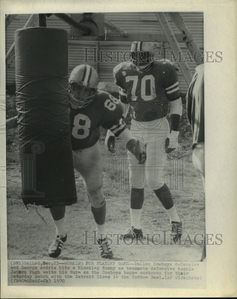 1970 Dallas Cowboys George Andrie hits blocking dummy at workout - Historic Images