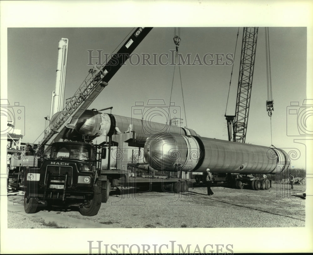 1984 Crane loads tanks for Liquefied Petroleum Gas - Historic Images