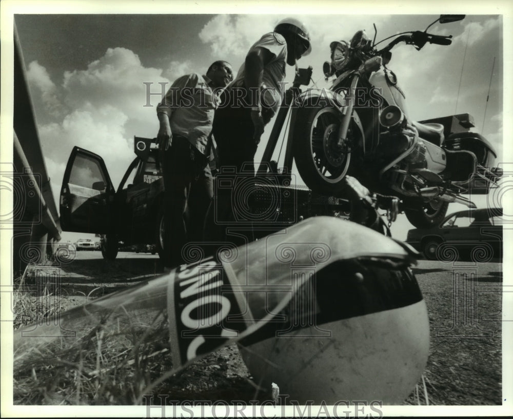 1990 Harris County Deputy Examine Motorcycle Accident - Historic Images