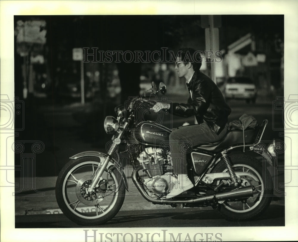 1985 Helmetless motorcycle rider in Houston, Texas - Historic Images