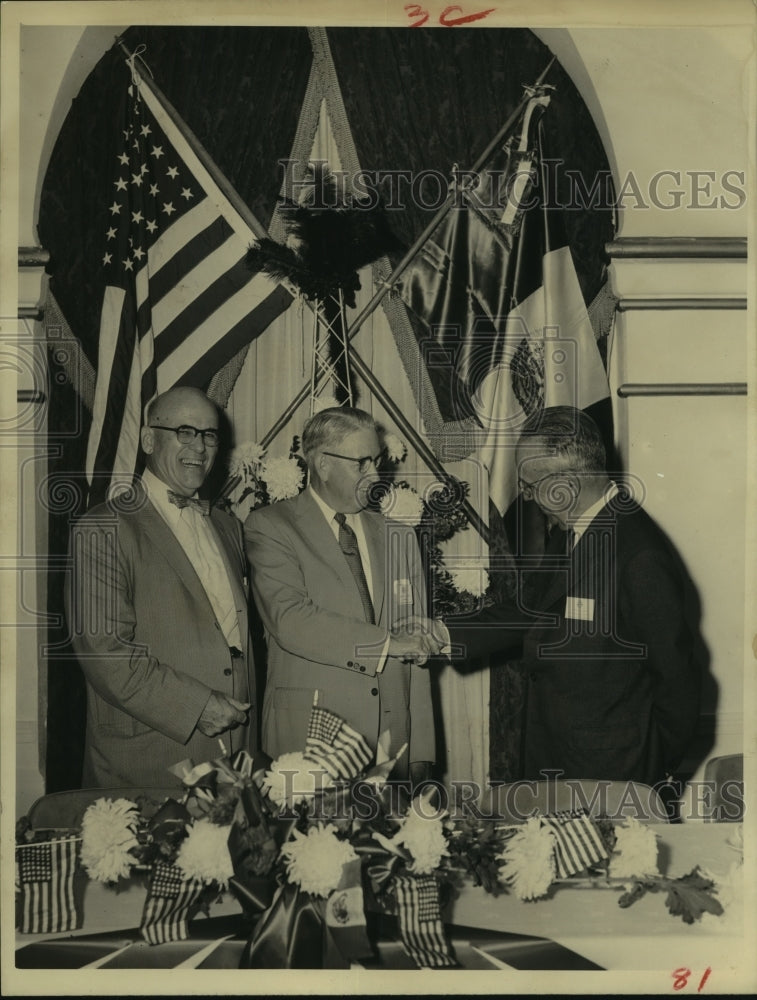 1957 Press Photo Men shake hands at Natural Gas Banquet - hcx11773-Historic Images