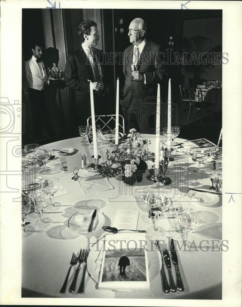 1985 Businessmen talk at dinner at The Remington Hotel, Houston - Historic Images