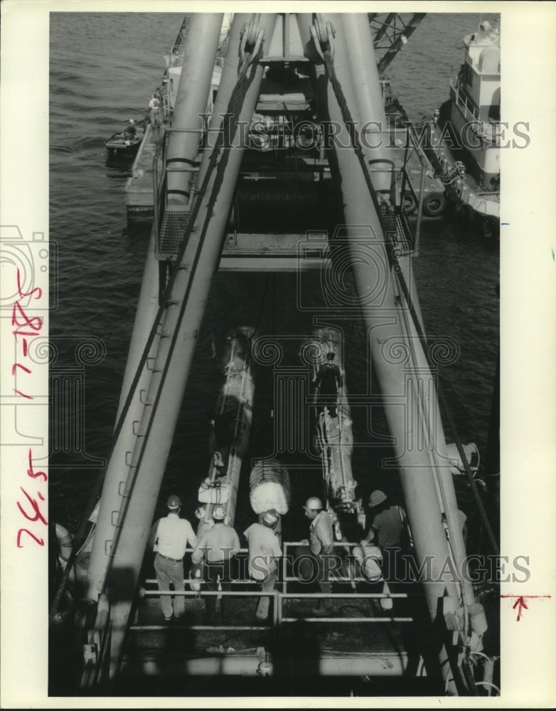 1980 Workers install pipeline off Texas Gulf Coast to Padre Island - Historic Images