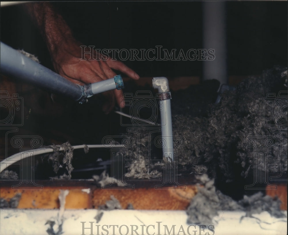 1991 David Wood Shows Water Pipe Damage In Home, Texas - Historic Images