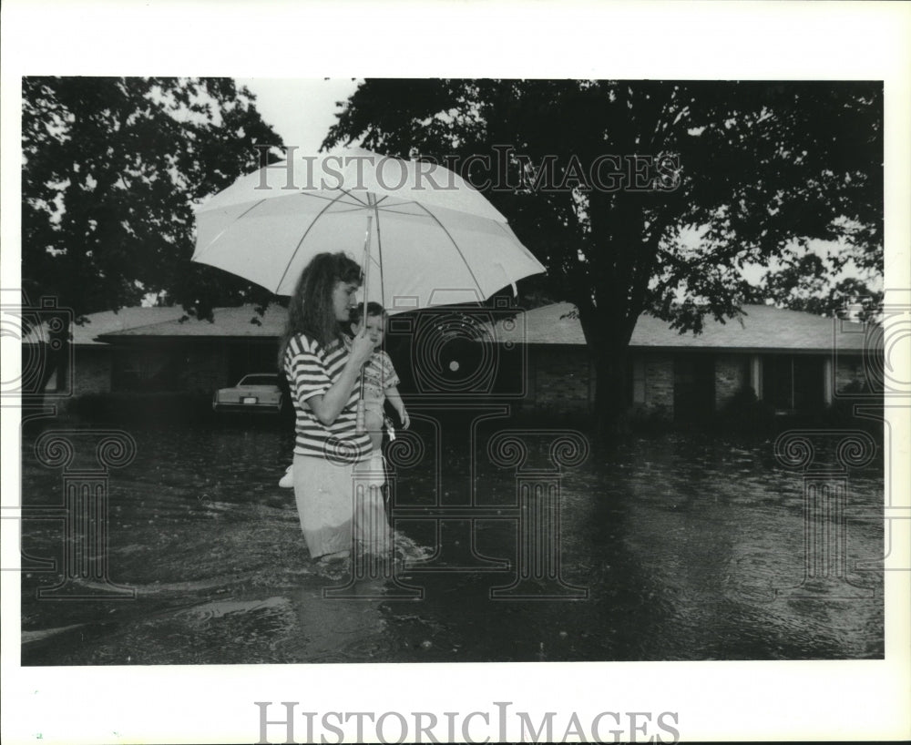 1991 Alison Henderson, Son Etan, Wade Through Flood, Pearland, Texas - Historic Images