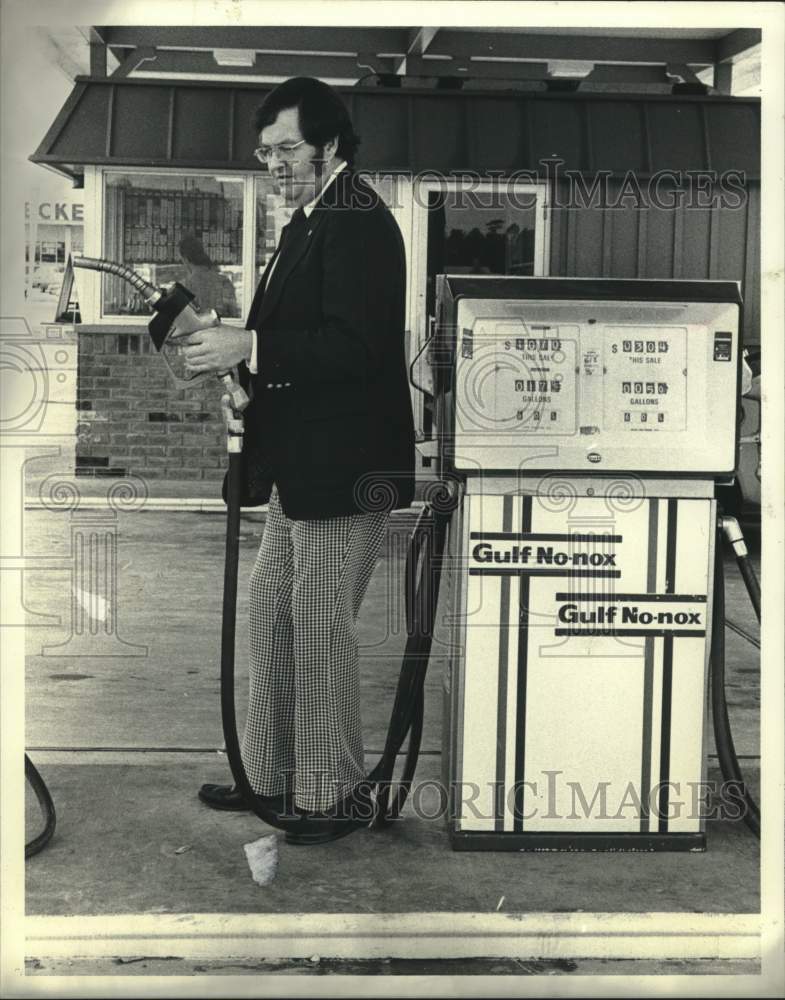 1981 Customer Pumps Gas at Gulf Station in Houston, Texas - Historic Images