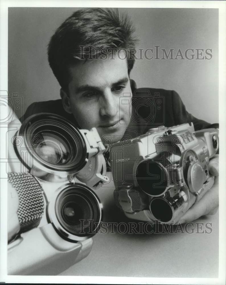 1992 Technician checks Sharp 8mm camcorder in Mahwah, New Jersey - Historic Images