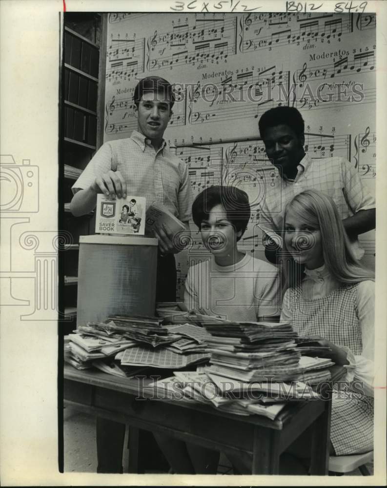 1969 Teens with savings stamps at Houston South Main Baptist church - Historic Images