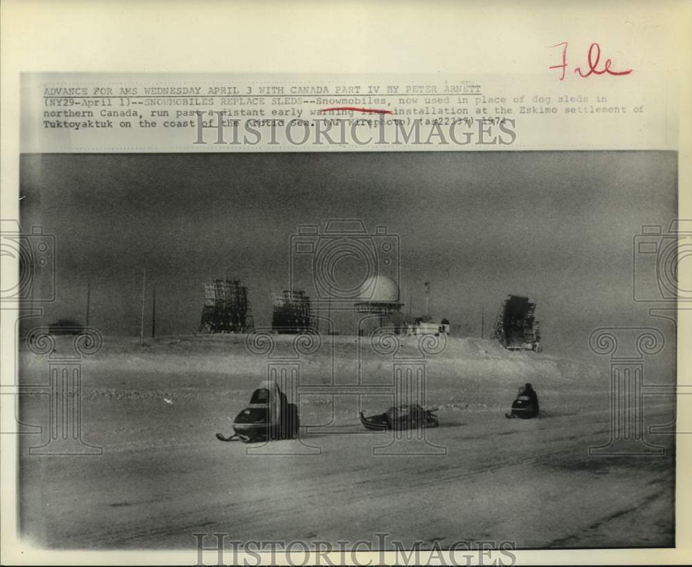 1974 Snowmobiles Replace Dog Sleds in Tuktoyaktuk, Canada - Historic Images