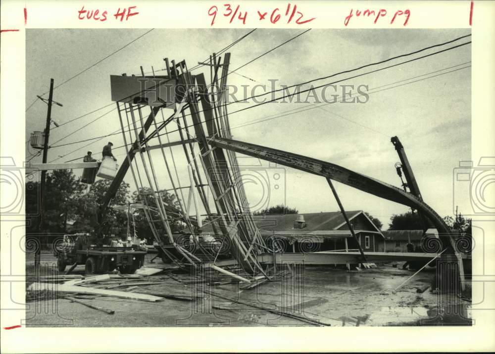 1979 Tornado blew sign into power lines on Hwy 6, Houston - Historic Images