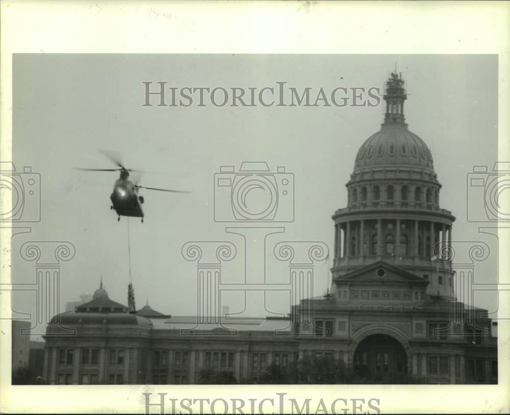 1985 Press Photo Helicopter flies over Texas Capitol in Austin - hcx22515- Historic Images